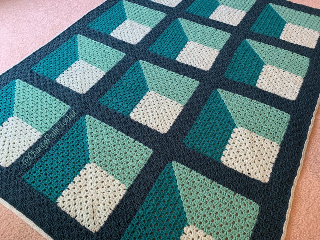 Crocheted afghan in 4 shades of green