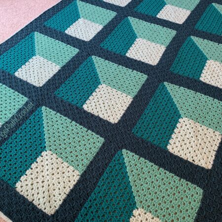 Crocheted afghan in 4 shades of green