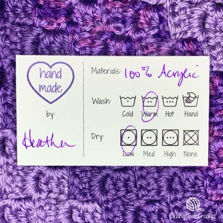 care instruction tag on a purple crochet background