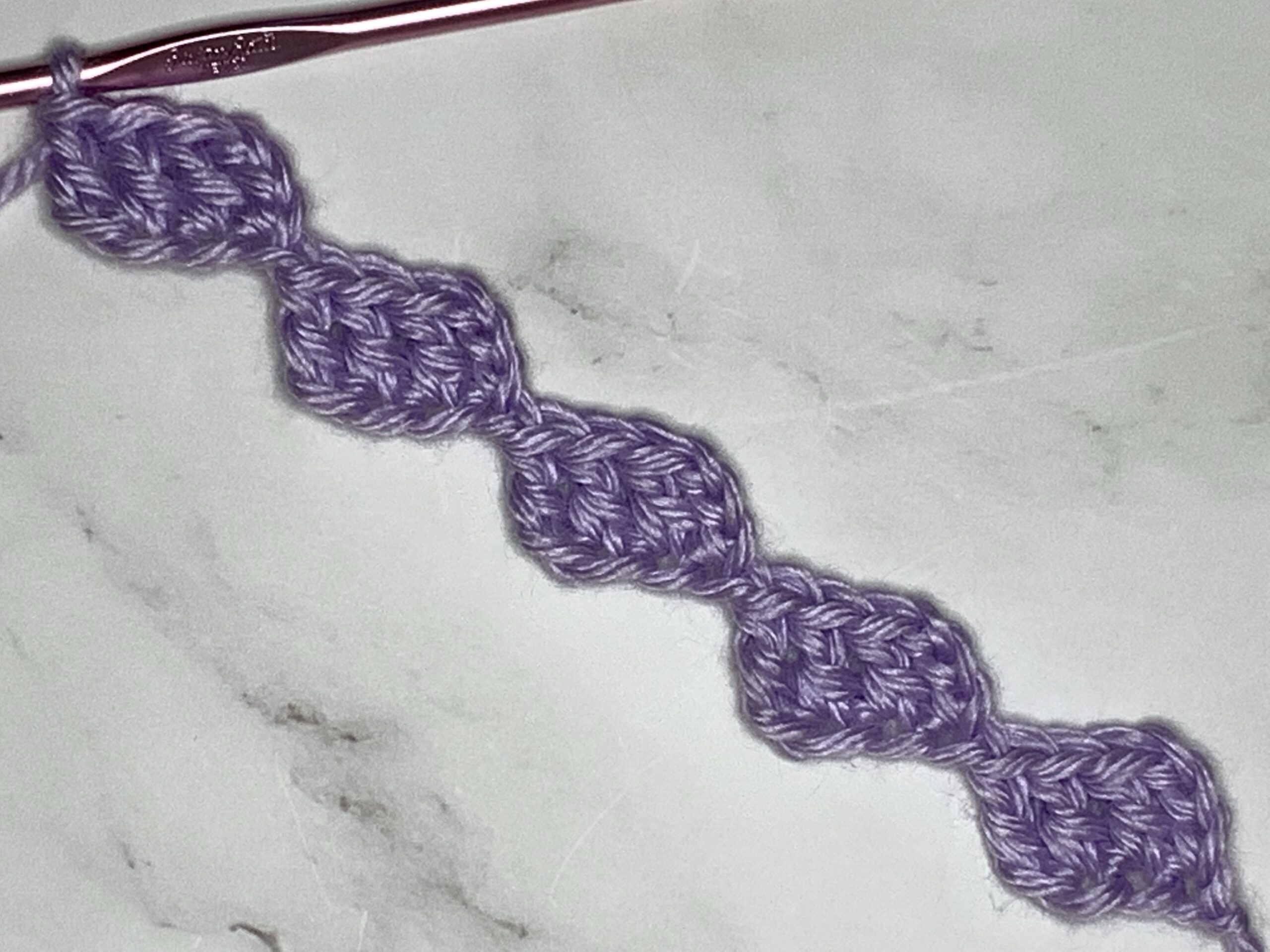 a string of floating crochet stitches