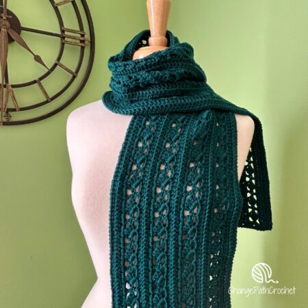 green scarf modeled on a mannequin