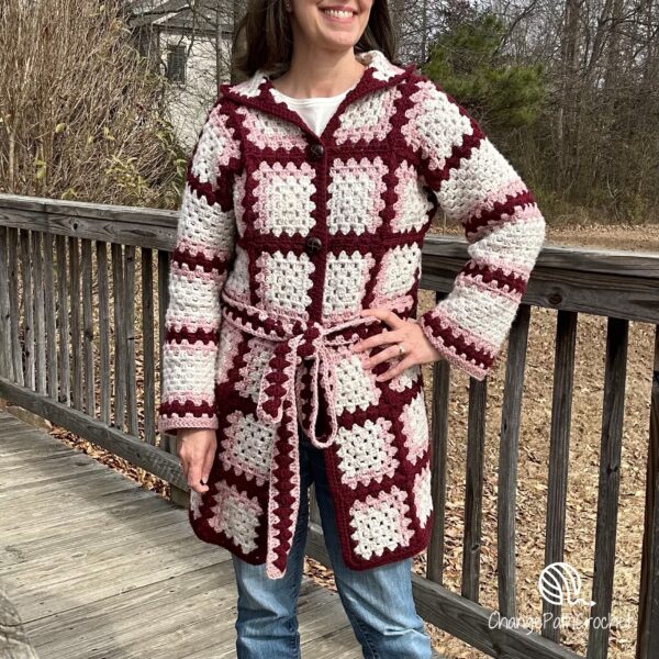 Woman wearing a plaid cardigan made with granny squares