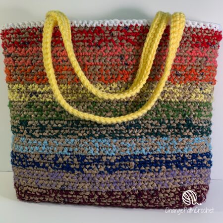 Rainbow tote bag made from yarn and plarn made from plastic grocery bags.